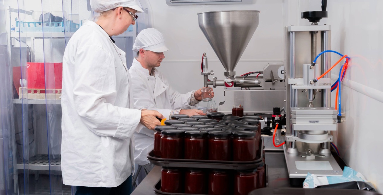 Max Mellor and his team bottling sweet chilli jam at Dauntsey
