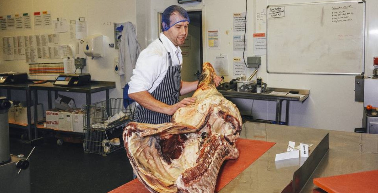 Chris Webber from Downland Produce preparing beef cuts