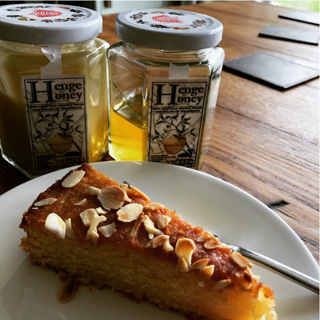 Henge Honey jars with a slice of honey cake