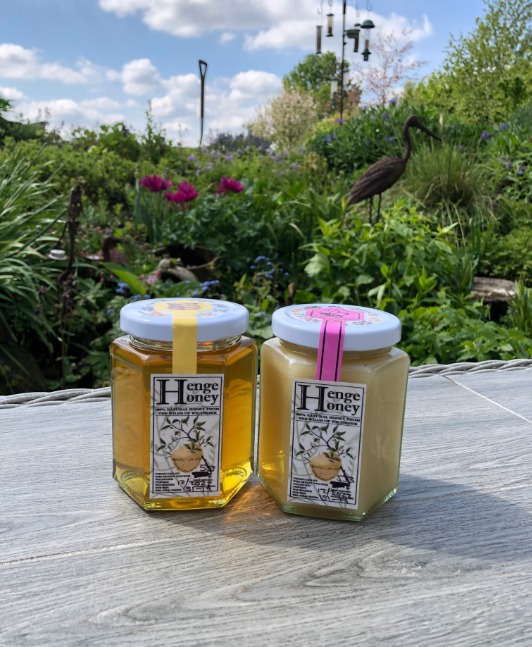 Jars of creamed Henge Honey and runny Henge Honey